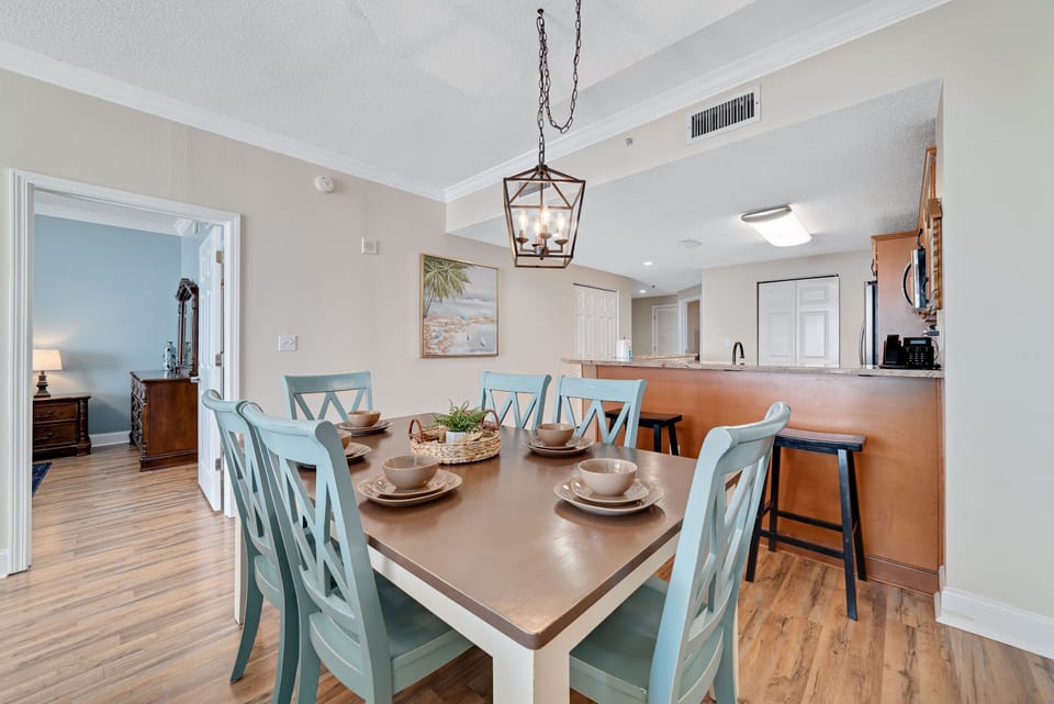 Sleek and sophisticated kitchen featuring a striking island with a stone countertop and comfortable bar stools.