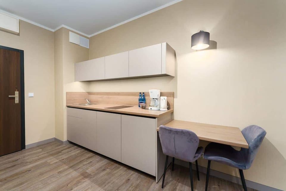 The fully equipped kitchenette includes everything you need for a home-cooked meal.