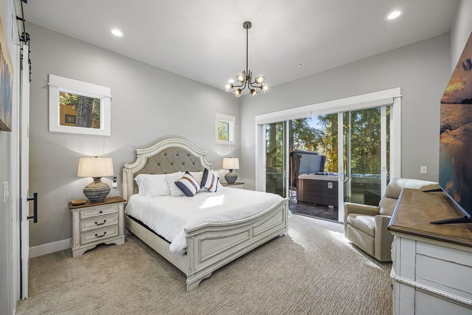 Main Floor - Bedroom 1, Master Suite, King Size Bed + En Suite 5 Piece Bathroom + Private Retreat