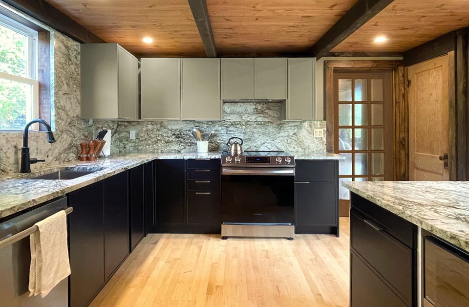 The kitchen has a vented induction cooktop and oven, microwave, dishwasher, and all the dishware, cookware and utensils you need.