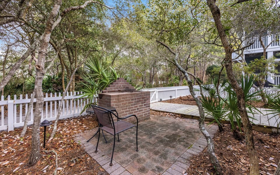Your private patio offers peaceful seating beneath mature trees, where you can relax with morning coffee or evening drinks.