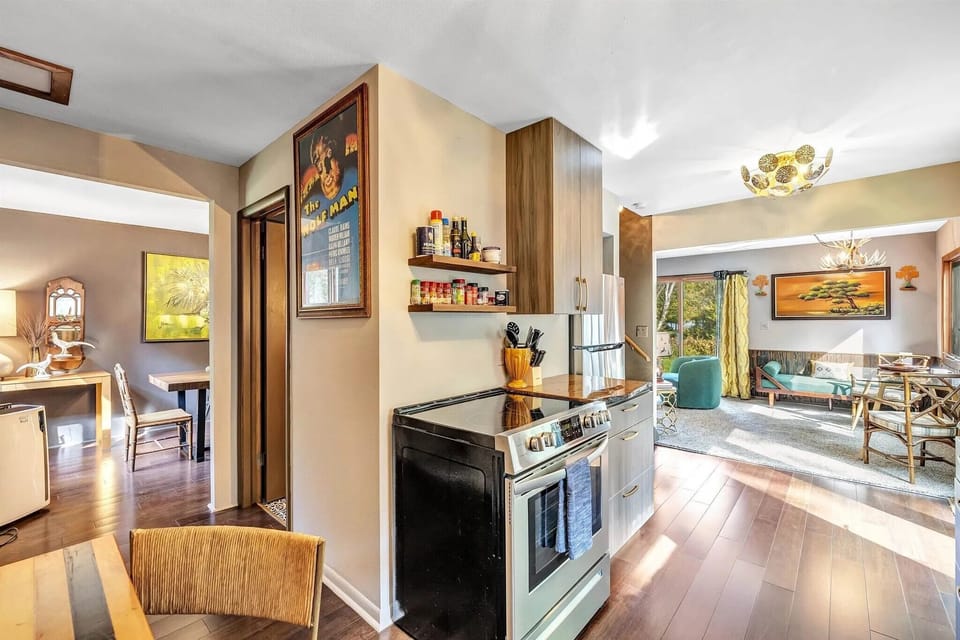 Fully stocked kitchen with stainless steel appliances & custom counters, perfect for cooking meals for groups