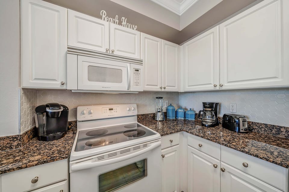 The fully equipped kitchen features granite countertops and has everything you need to prepare your meals.