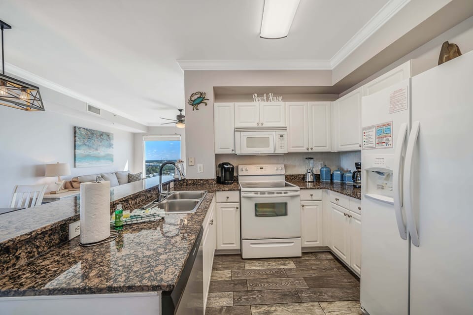 The fully equipped kitchen features granite countertops and has everything you need to prepare your meals.