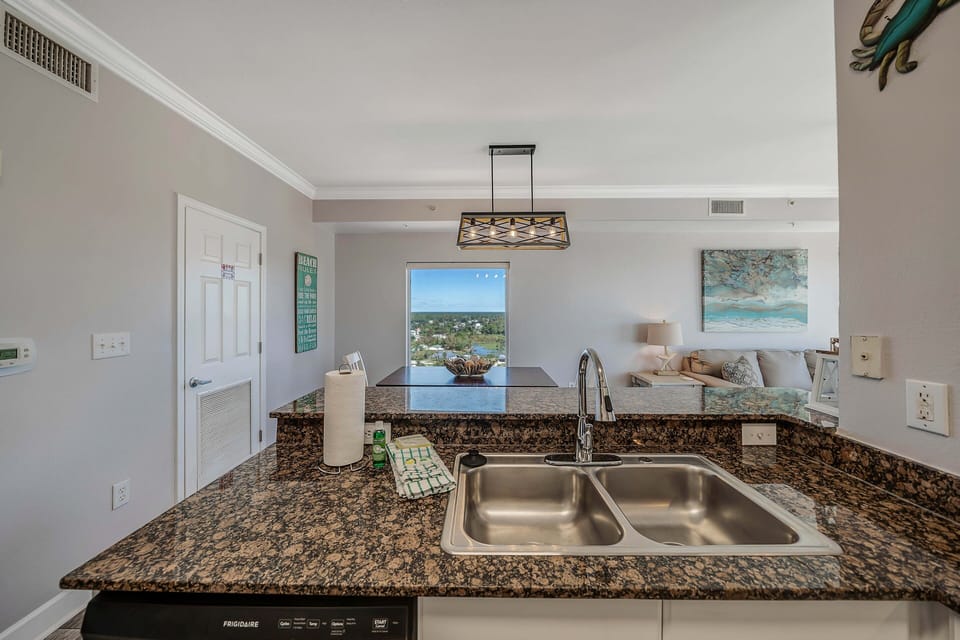 The fully equipped kitchen features granite countertops and has everything you need to prepare your meals.