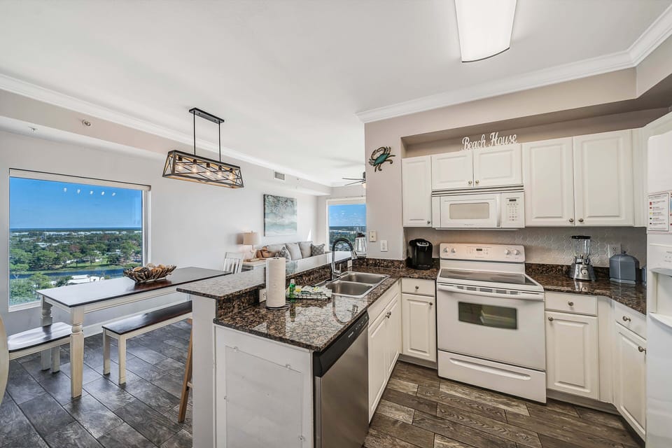 The fully equipped kitchen features granite countertops and has everything you need to prepare your meals.