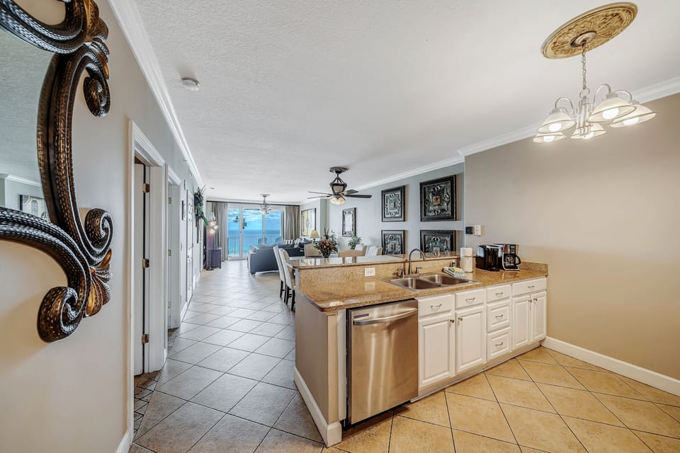 The fully equipped kitchen features granite countertops and stainless-steel appliances.