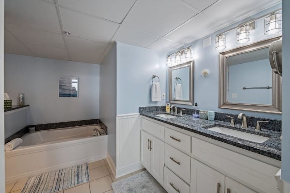 After a fun day on the beach, sink into the soaker tub with a glass of wine.