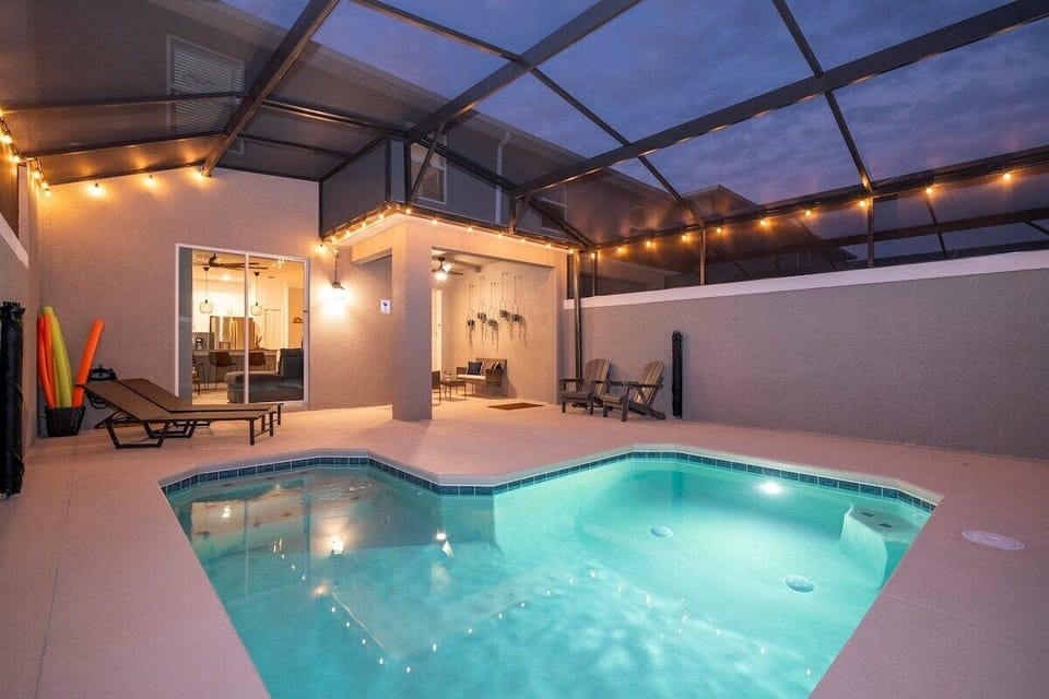 A spacious and inviting pool area, perfect for guests seeking that extra touch of luxury. The expansive pool, illuminated by the gentle glow of elegant lighting, offers a serene escape where you can unwind after a day of exploration. The cozy loungers provide the perfect spot to soak up the tranquil atmosphere, with every detail designed to make your stay an unforgettable exper...