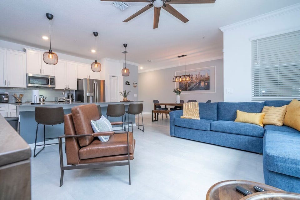 Open living space that seamlessly connects the beautiful kitchen and dining area, offering a perfect blend of comfort and style.