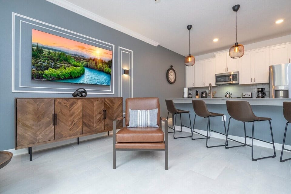 This is a spacious and modern living area that exudes comfort and style. 