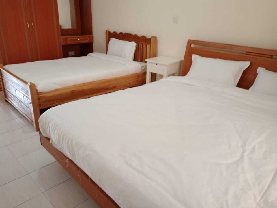 Family Twin Room | Premium bedding, blackout drapes, iron/ironing board, free WiFi
