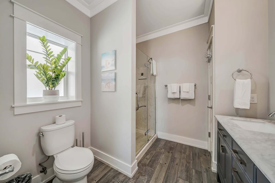 Ensuite master bathroom with double sinks and spacious walk-in shower.
