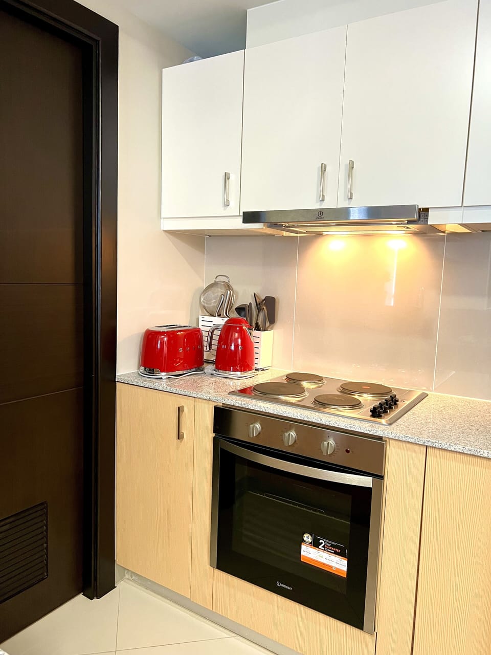 The kitchen has a electric 4-burner cook-top with built in oven.
