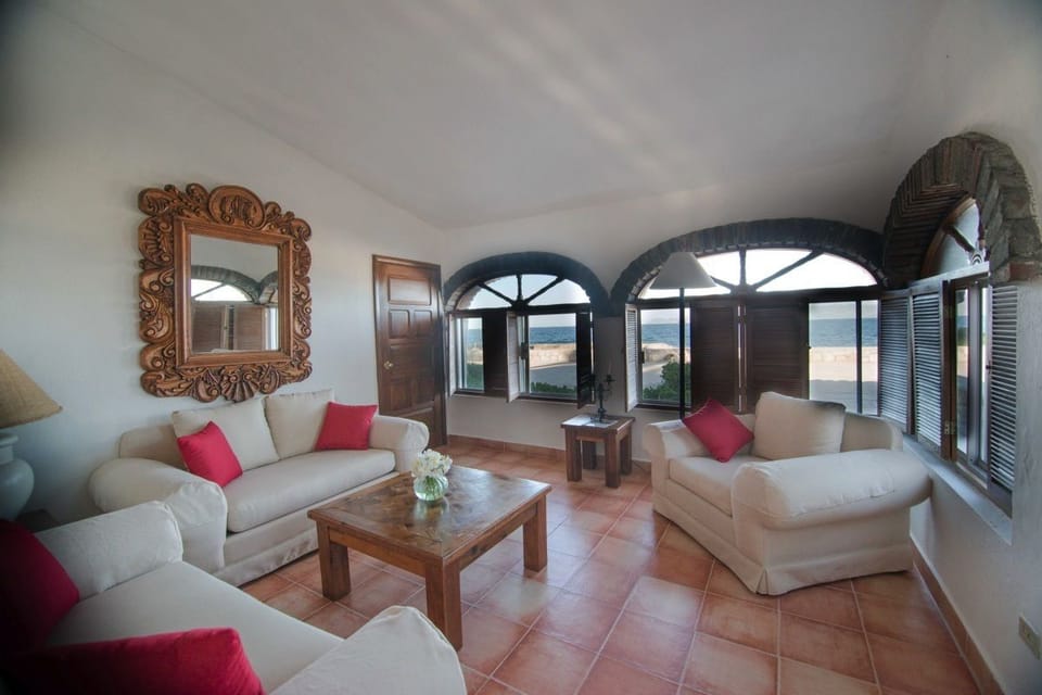 Suite, Oceanfront | Living area | 42-inch flat-screen TV with satellite channels, TV