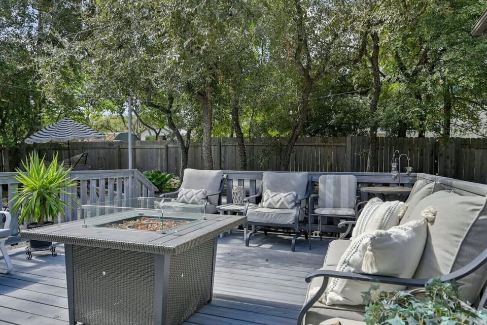 Spacious backyard deck with comfy seating and fire pit—your private retreat at Sterling Serenity, pet‑friendly and peaceful.