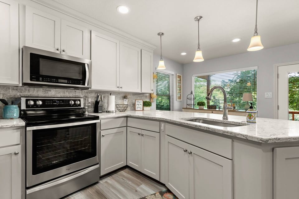 Experience the convenience of this modern, open kitchen, bathed in natural light and designed for both style and functionality.