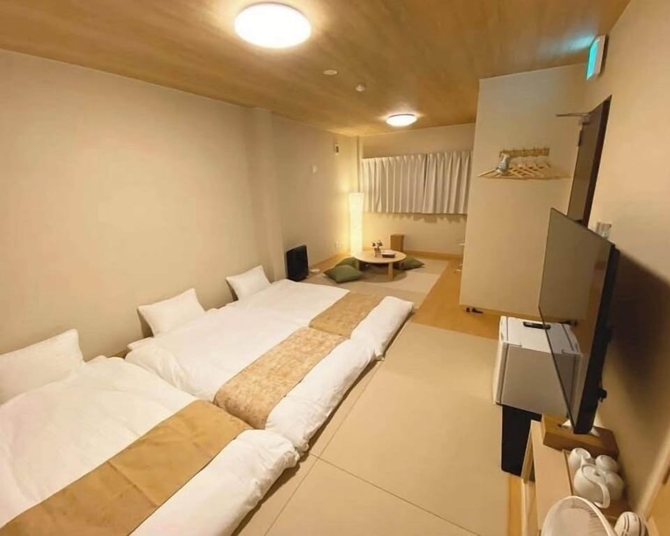 Triple Room | Blackout drapes, WiFi (free), bed sheets