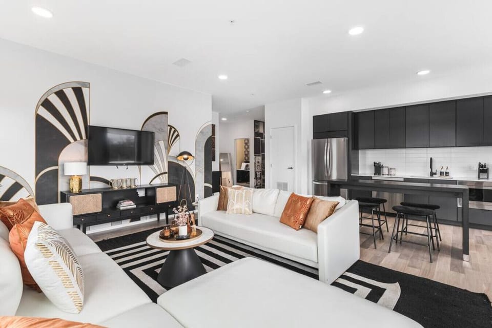 Spacious, stylish living room with a Smart TV and comfortable new furnishings for you to relax.