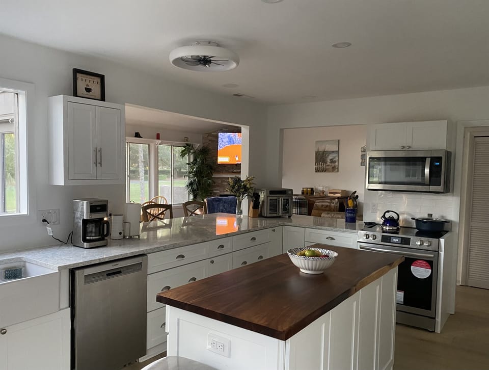 View from kitchen into open DR/FR/LR area 