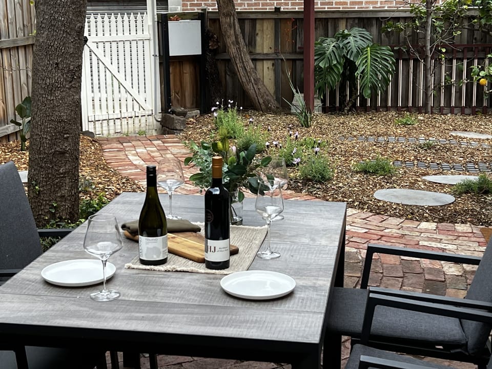 Attractive outdoor dining area, perfect for enjoying warm days and evenings..