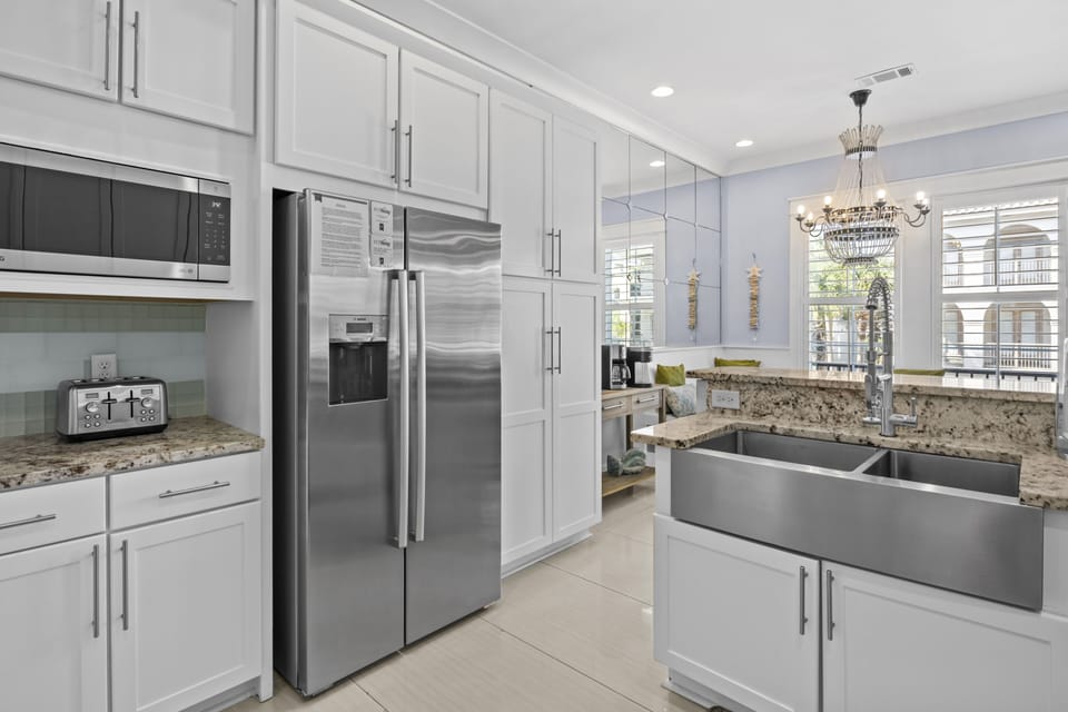 Prepare your favorite meals in this chef-inspired kitchen with granite counters, stainless steel appliances, and plenty of workspace for culinary adventures.
