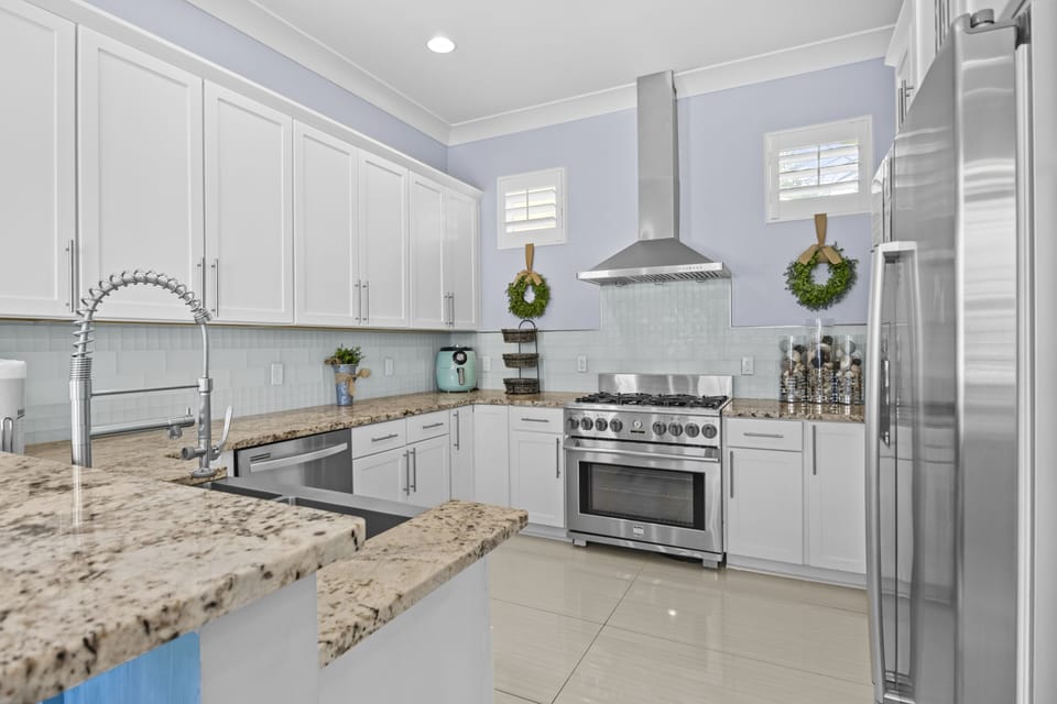 Your spacious gourmet kitchen invites culinary adventures with granite countertops, stainless steel appliances, and ample prep space for memorable meals.
