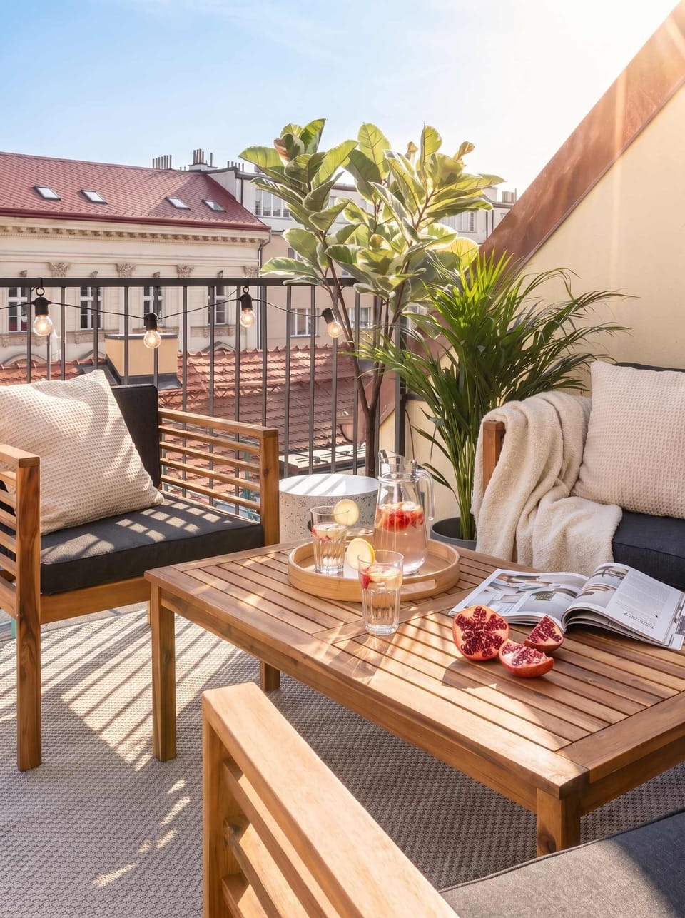 The private balcony on the top of the building is furnished with outdoor seating for your ultimate relax
