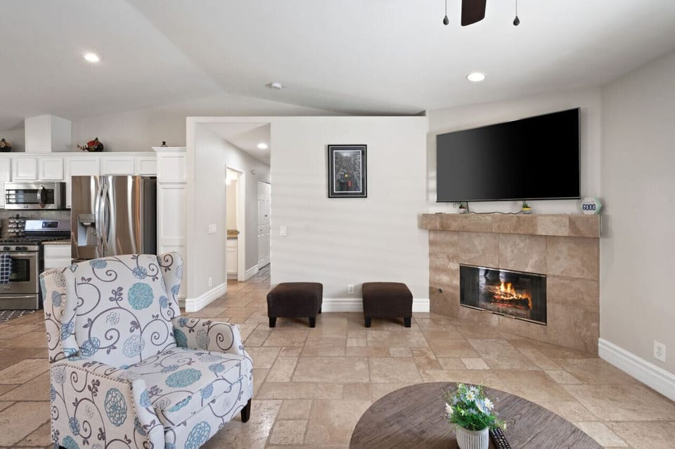 Cozy living room w/ fireplace, TV & seating for relaxing nights in