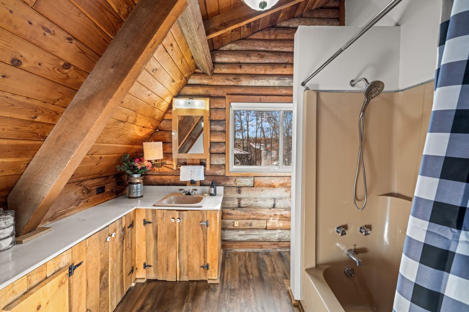 2nd bathroom with tub/shower.  Trimmed out in real reclaimed barnwood.