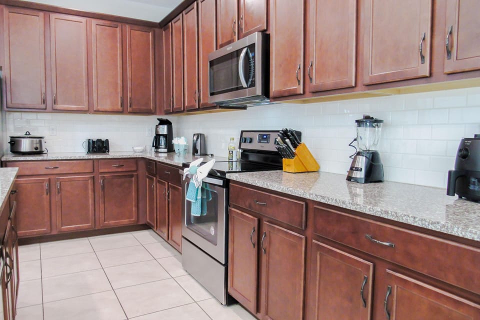 Stocked with all the glassware, crockery, silverware and counter top appliances you need