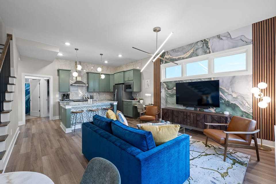 Living room open to the kitchen allows you to prepare a gourmet meal while engaging with the family hanging out in the living room, ensuring everyone stays connected whether cooking or relaxing.