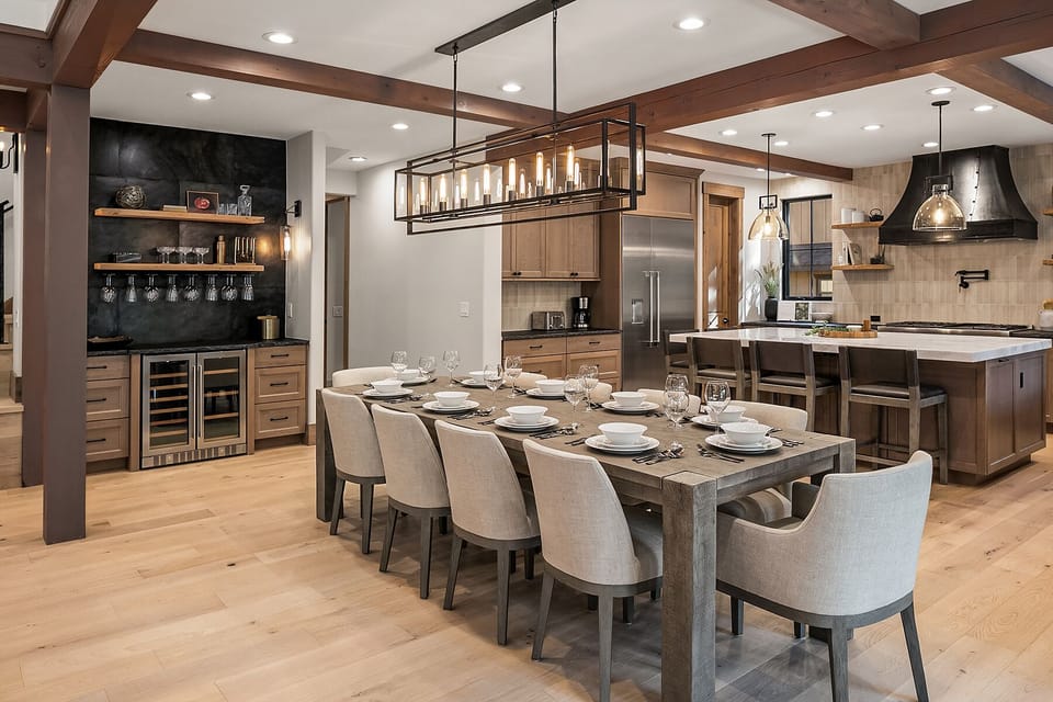 Kings Landing: - Beautifully appointed dining table with a wine bar close by.