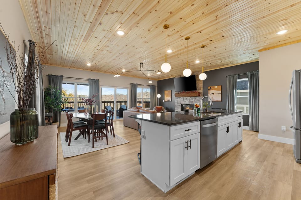 Living Room & Kitchen: Spacious, modern retreat with scenic views and stylish decor awaits you!