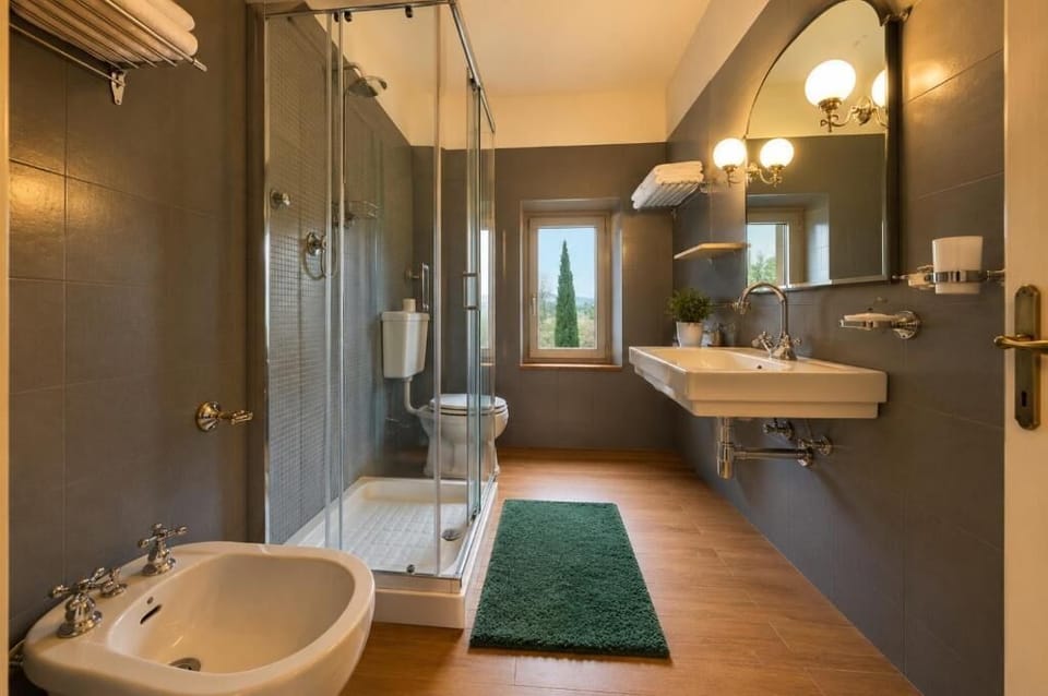 Deep soaking tub, designer toiletries, hair dryer, bidet