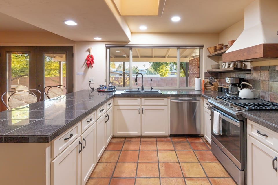 kitchen has gas stove and cooktop with griddle