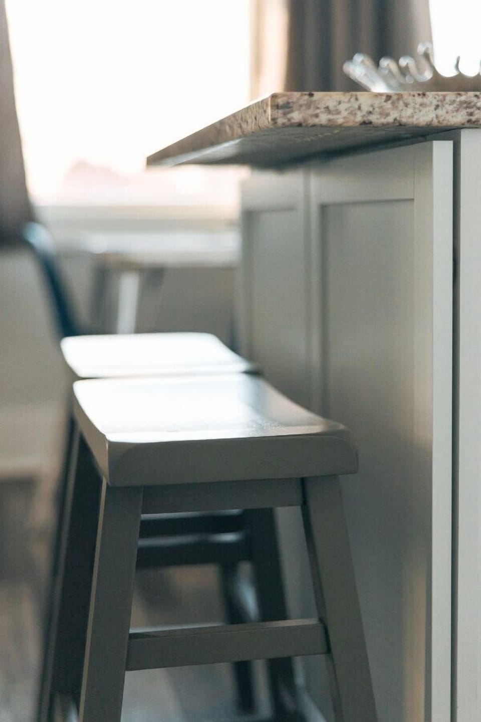 A sleek kitchen island with barstool seating, perfect for casual dining or work.