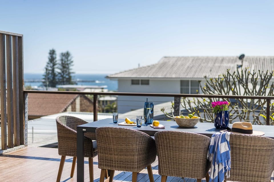 Bimbajong Pines - Coast accommodation in Yamba town with Ocean views - Upstairs balcony with ocean views, barbeque & 8 seater dining set