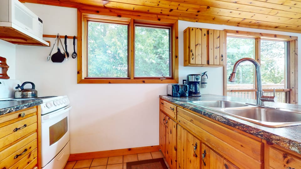 A fully equipped kitchen awaits you, with cutlery, cookery, pots and pans.