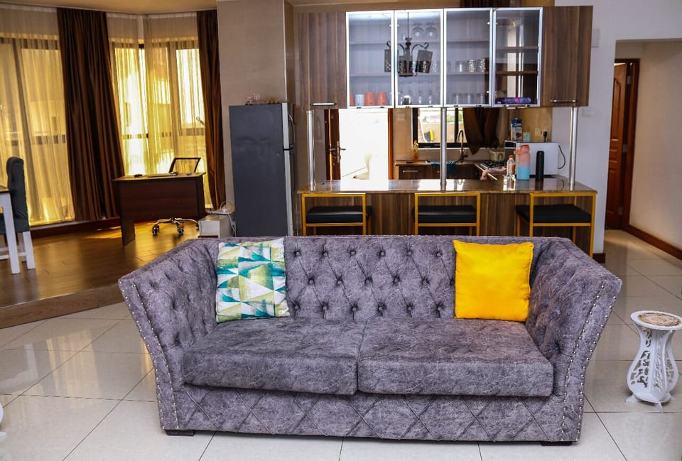Deluxe Apartment | Living area | 32-inch Smart TV with digital channels