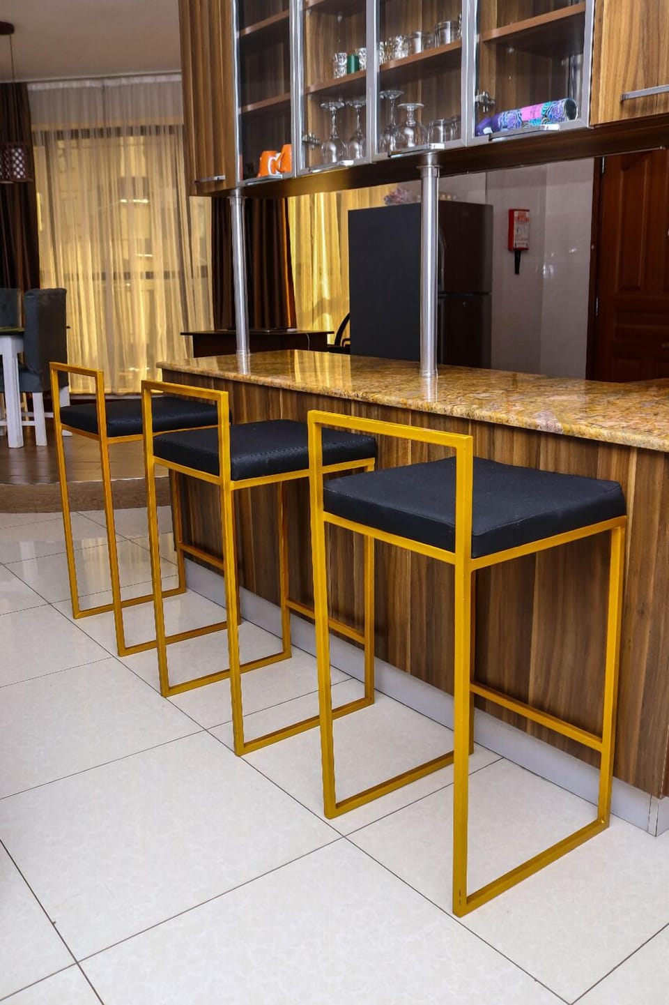 Fridge, microwave, cookware/dishes/utensils, dining tables