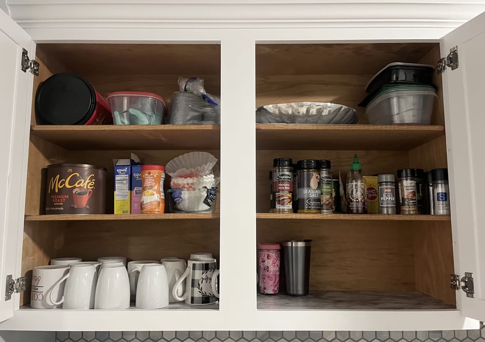 Coffee supplies, mugs, and spices.