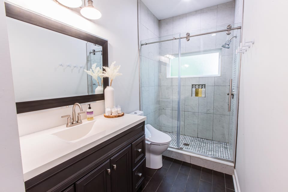 Bathroom 1: Vanity, Bidet Toilet, & Walk In Shower 