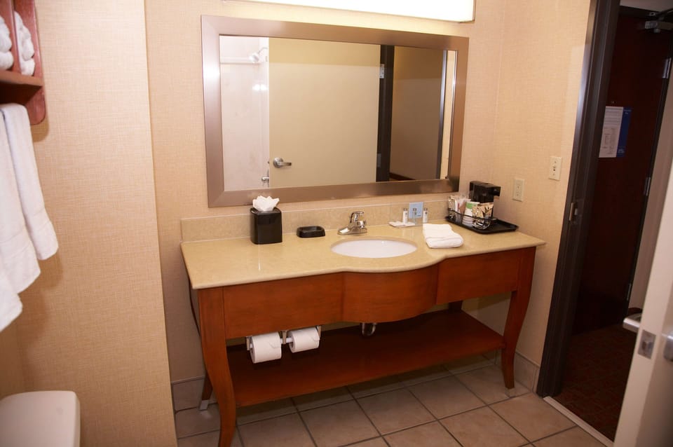 Two Queen Beds | Bathroom | Hair dryer, towels, soap, shampoo