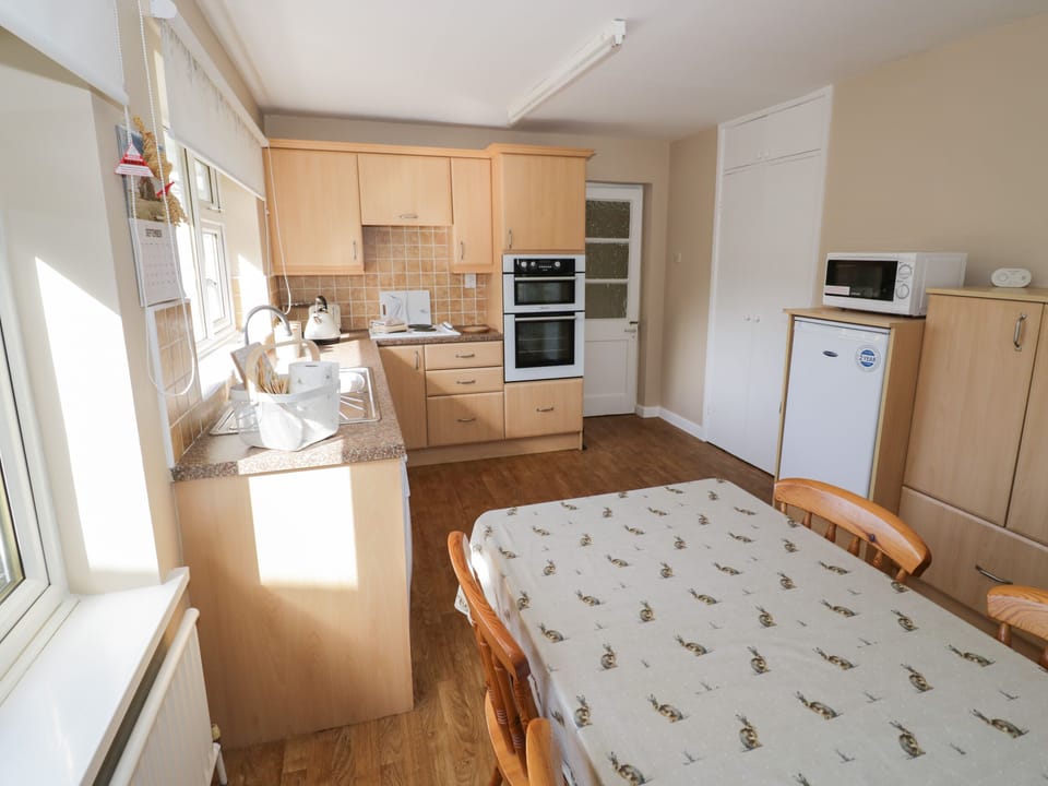 Fridge, electric kettle, toaster, cookware/dishes/utensils