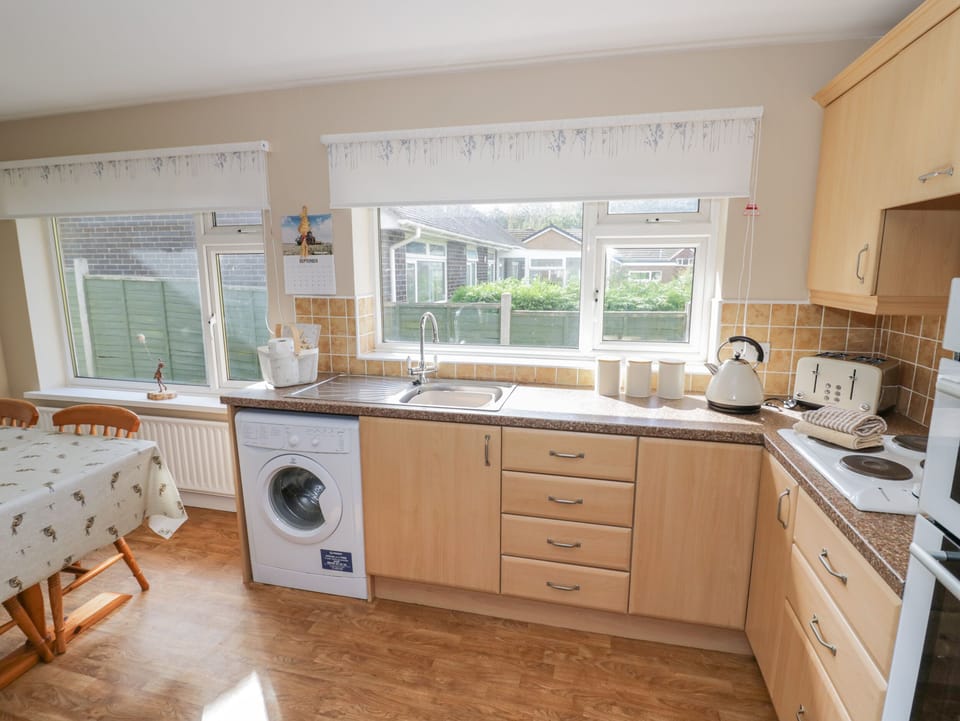 Fridge, electric kettle, toaster, cookware/dishes/utensils