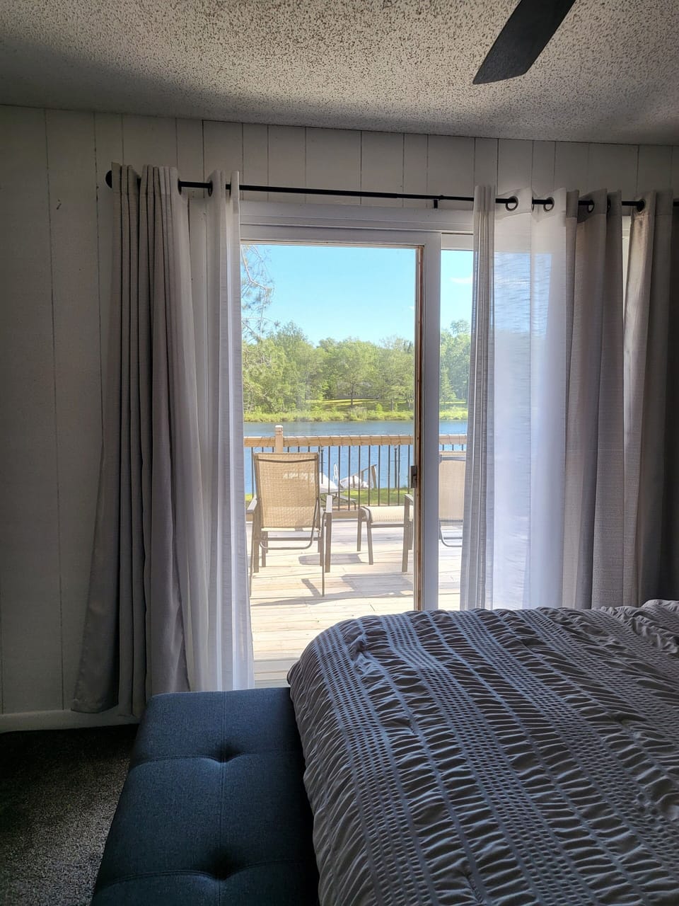 master bedroom to deck with queen bed