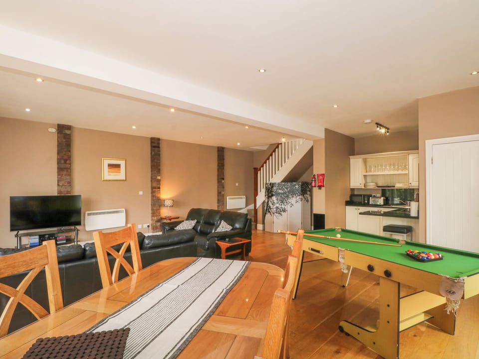 Flat-screen TV, fireplace, video-game console, DVD player