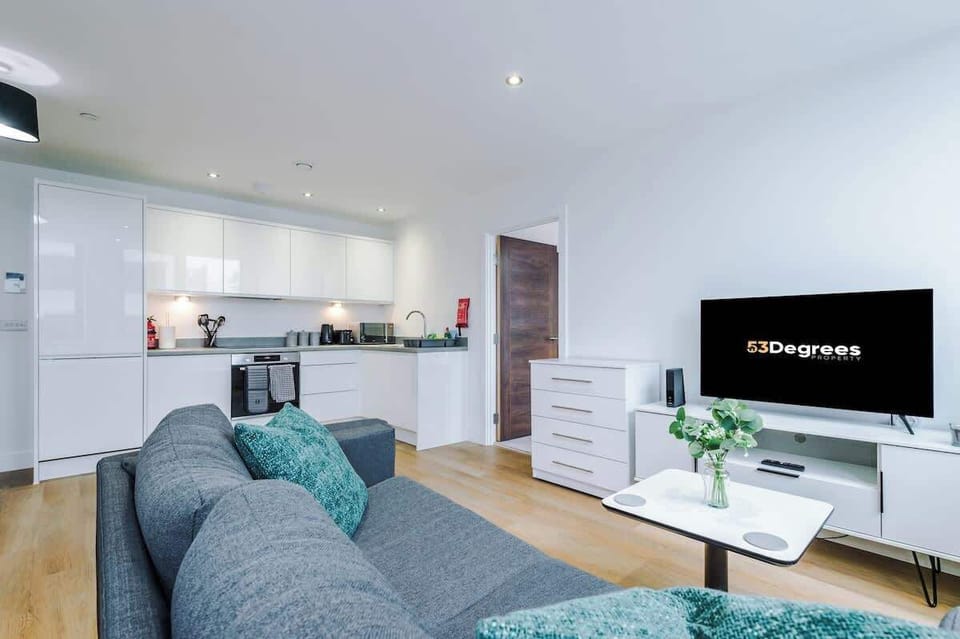 The open-plan living room, dining area and kitchen benefit from a comfortable sofa and 40-inch SMART TV.