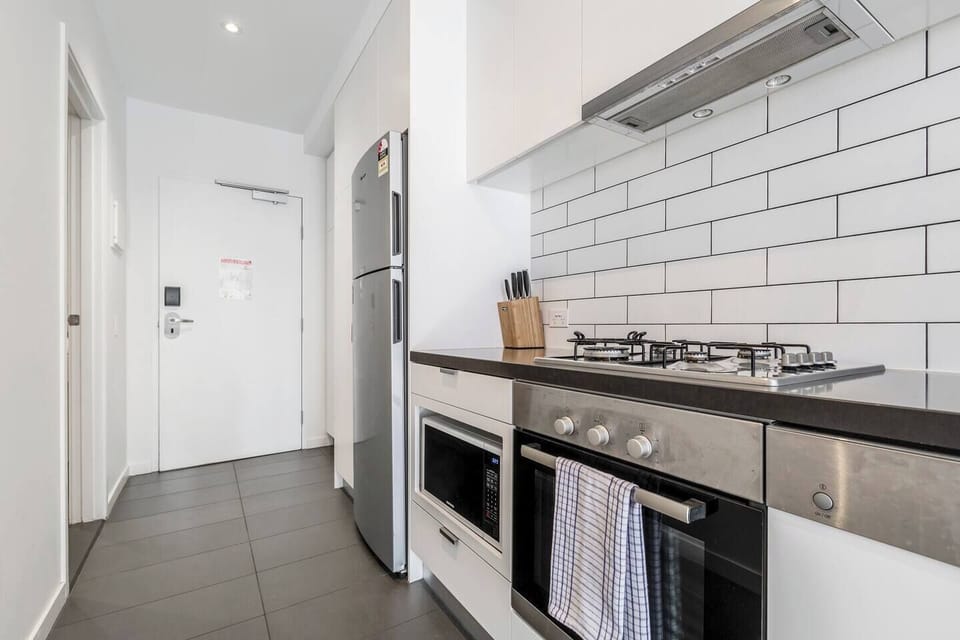 Compact but well-equipped, the full kitchen invites you to whip up a quick bite to eat before exploring the city. 
